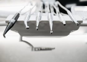 Close-up view of modern dental instruments in a clinical setting, showcasing professional equipment.